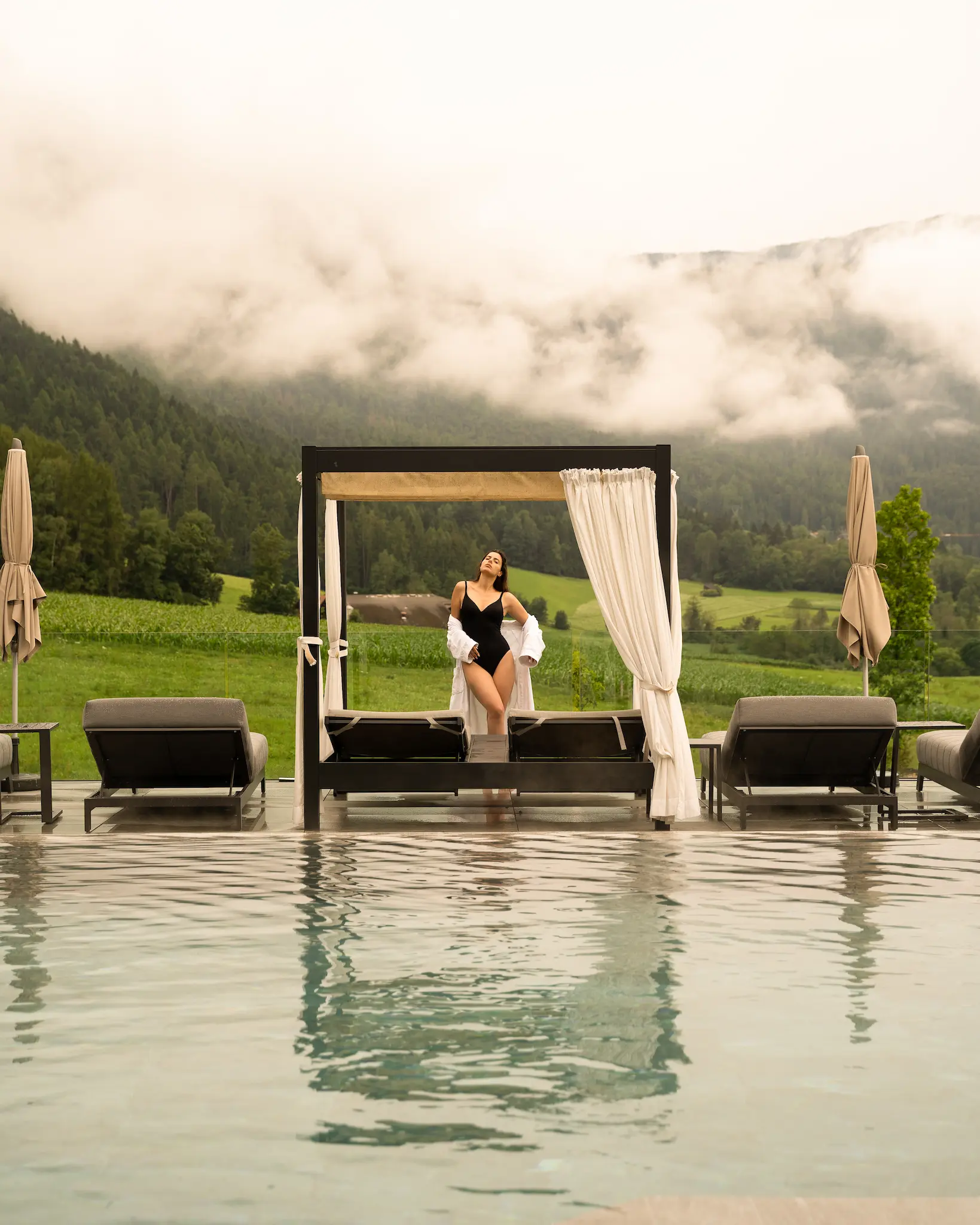 A woman in the pool area of Winkler hotel